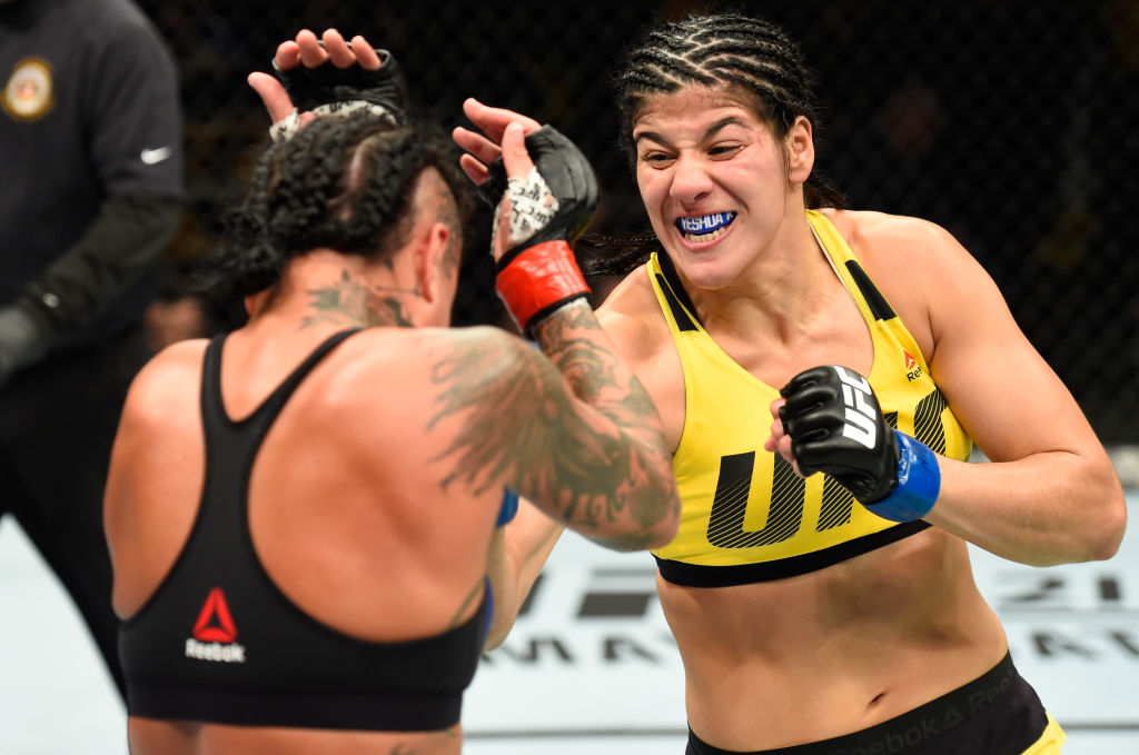 KANSAS CITY, MO - APRIL 15: (R-L) Ketlen Vieira of Brazil punches Ashlee Evans-Smith in their women's bantamweight fight during the UFC Fight Night event at Sprint Center on April 15, 2017 in Kansas City, Missouri. (Photo by Josh Hedges/Zuffa LLC)