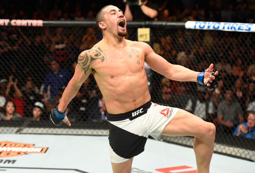  KANSAS CITY, MO - APRIL 15: (R-L) Robert Whittaker of New Zealand celebrates his TKO victory over Jacare Souza of Brazil in their middleweight fight during the UFC Fight Night event at Sprint Center on April 15, 2017 in Kansas City, Missouri. (Photo by Josh Hedges/Zuffa LLC)