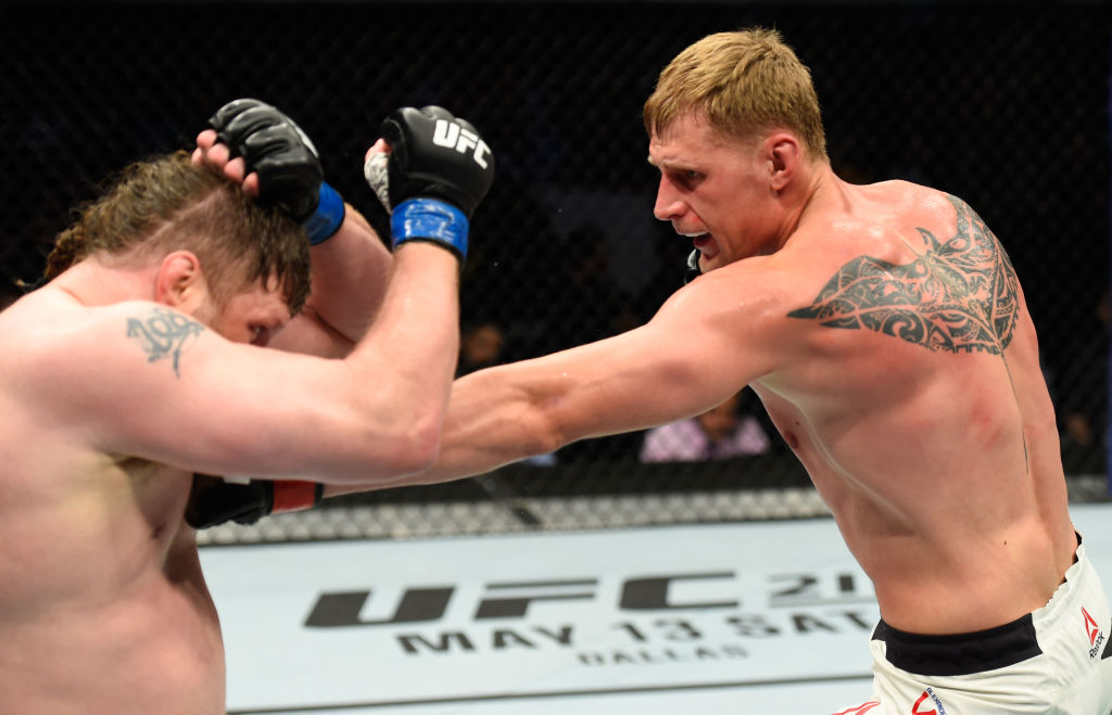 KANSAS CITY, MO - APRIL 15: (R-L) Alexander Volkov of Russia punches Roy Nelson in their heavyweight fight during the UFC Fight Night event at Sprint Center on April 15, 2017 in Kansas City, Missouri. (Photo by Josh Hedges/Zuffa LLC)