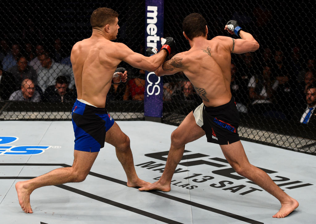 NASHVILLE, TN - APRIL 22: (L-R) Al Iaquinta knocks down Diego Sanchez with a right in their lightweight bout during the UFC Fight Night event at Bridgestone Arena on April 22, 2017 in Nashville, Tennessee. (Photo by Jeff Bottari/Zuffa LLC)