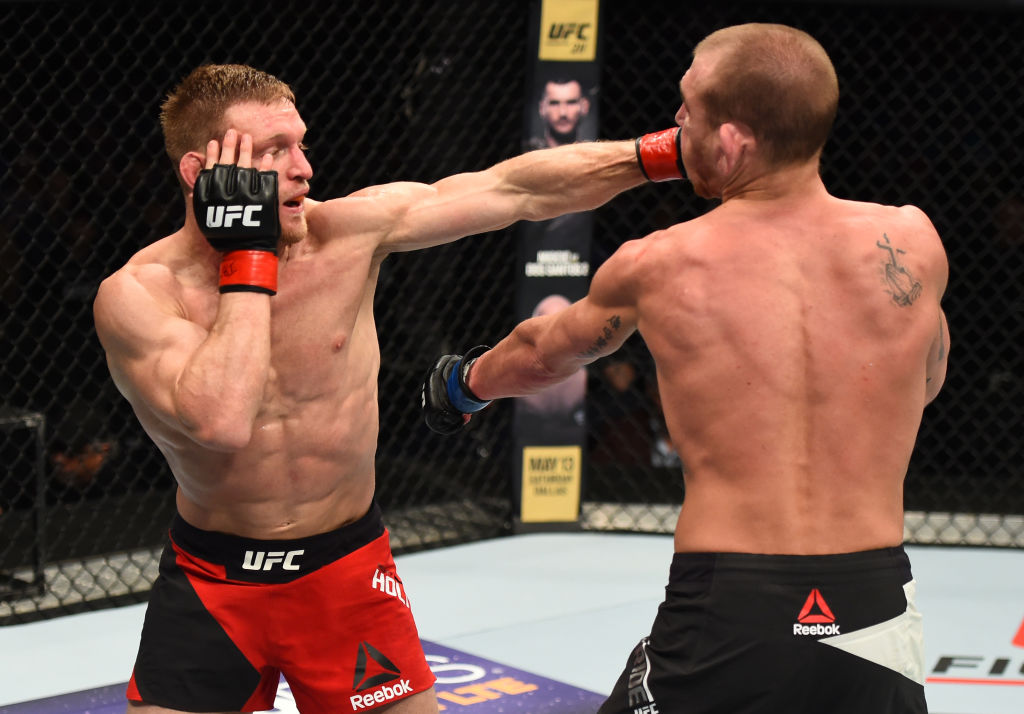 NASHVILLE, TN - APRIL 22: (L-R) Scott Holtzman punches Michael McBride in their lightweight bout during the UFC Fight Night event at Bridgestone Arena on April 22, 2017 in Nashville, Tennessee. (Photo by Jeff Bottari/Zuffa LLC)