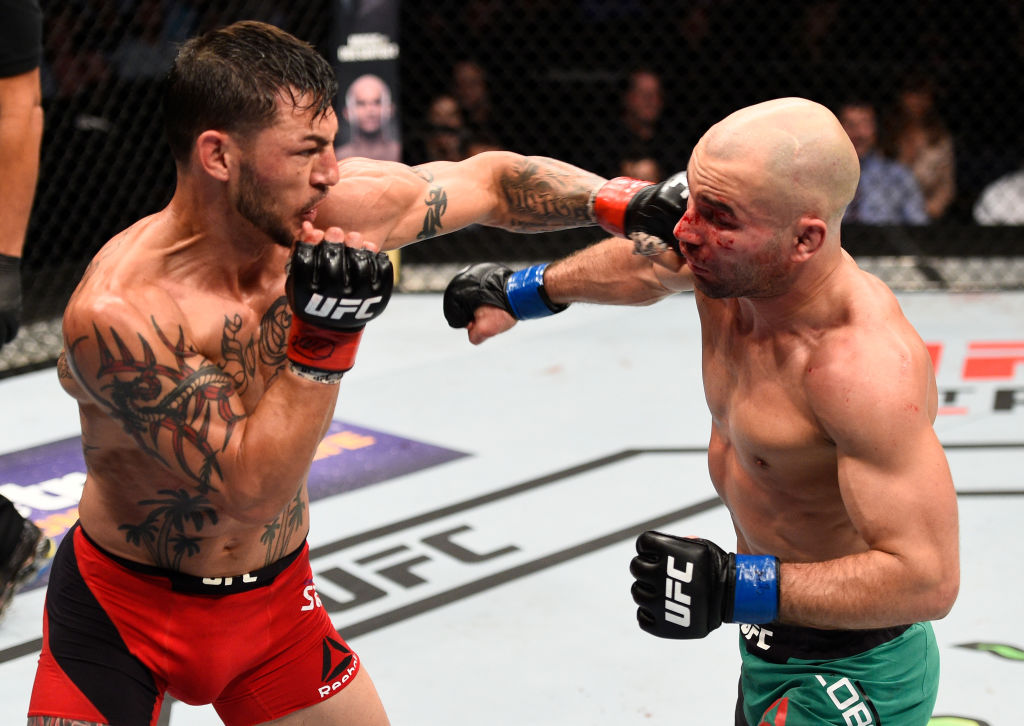 NASHVILLE, TN - APRIL 22: (L-R) Cub Swanson punches Artem Lobov of Russia in their featherweight bout during the UFC Fight Night event at Bridgestone Arena on April 22, 2017 in Nashville, Tennessee. (Photo by Jeff Bottari/Zuffa LLC)