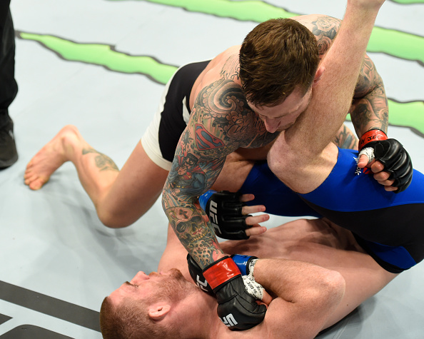 BUFFALO, NY - APRIL 08: Gregor Gillespie lands a punch on Andrew Holbrook in their lightweight bout during the UFC 210 event at KeyBank Center on April 8, 2017 in Buffalo, New York. (Photo by Josh Hedges/Zuffa LLC/Zuffa LLC via Getty Images)