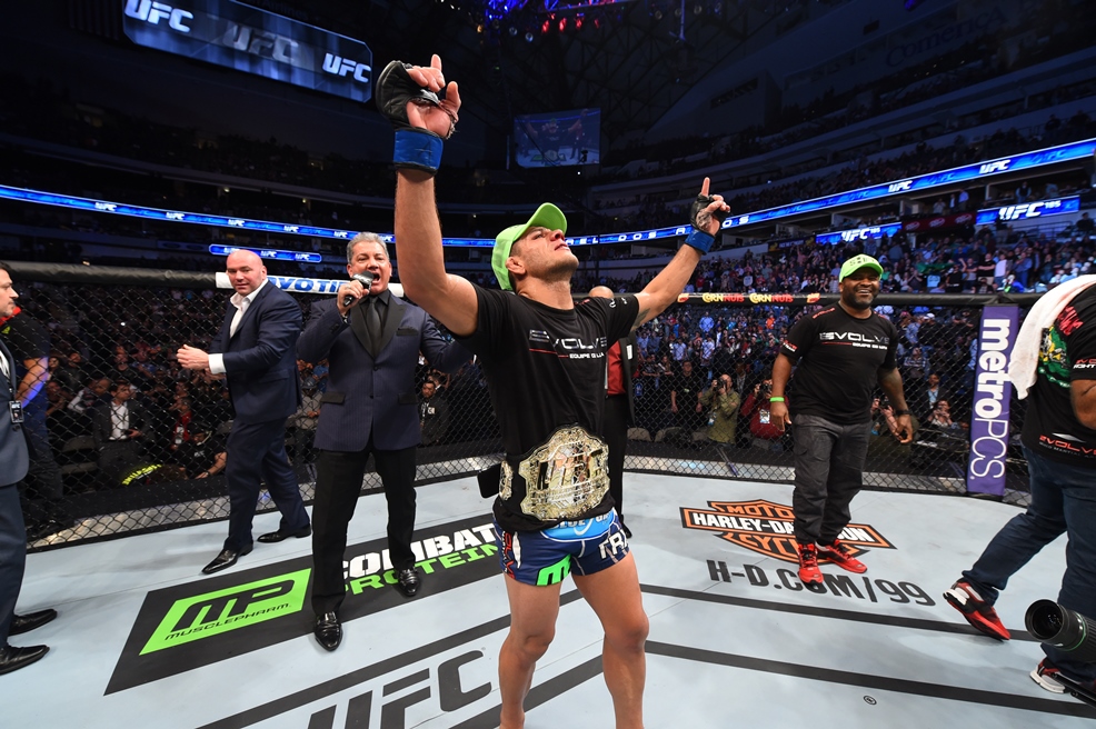 Rafael Dos Anjos celebrates becoming UFC lightweight champion at UFC 185