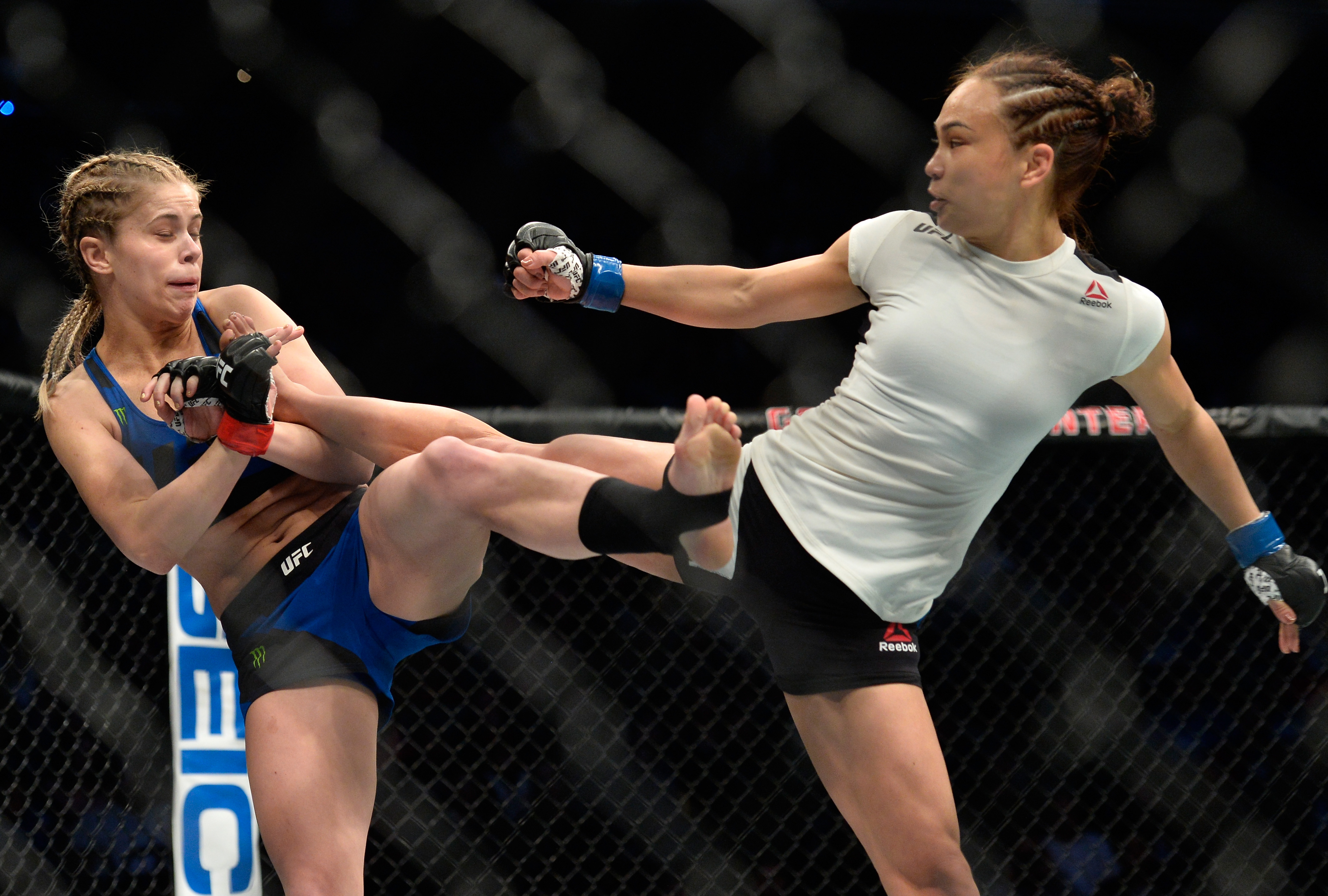 Michelle Waterson kicks Paige VanZant during their Fight Night bout in December