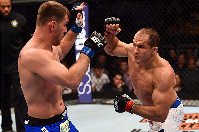 Dos Santos punches Stipe Miocic during their first meeting in December of 2014