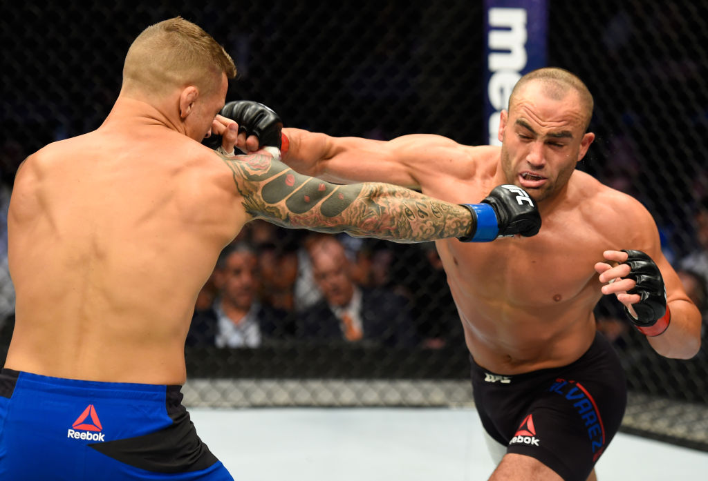 DALLAS, TX - MAY 13: (L-R) Dustin Poirier punches Eddie Alvarez in their lightweight fight during the UFC 211 event at the American Airlines Center on May 13, 2017 in Dallas, Texas. (Photo by Josh Hedges/Zuffa LLC)