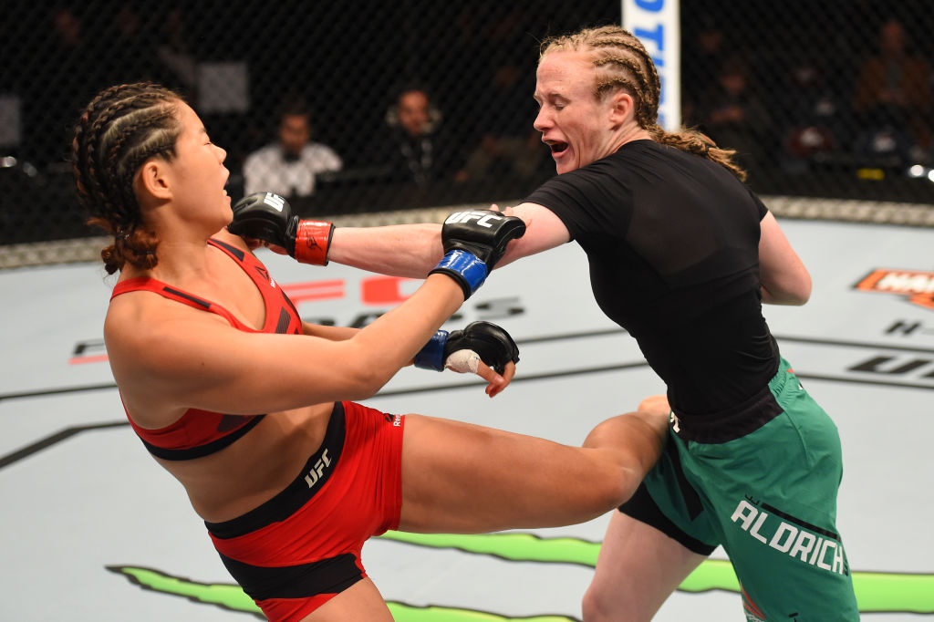 AUCKLAND, NEW ZEALAND - JUNE 11: (R-L) JJ Aldrich punches Chan-Mi Jeon of South Korea in their women's strawweight fight during the UFC Fight Night event at the Spark Arena on June 11, 2017 in Auckland, New Zealand. (Photo by Josh Hedges/Zuffa LLC)