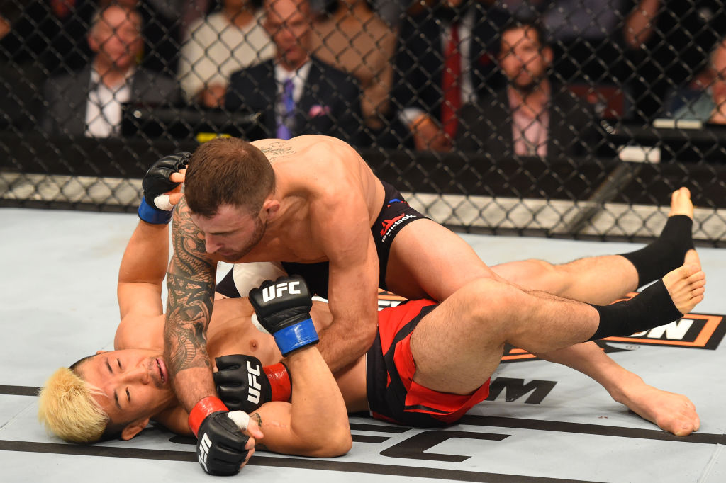 AUCKLAND, NEW ZEALAND - JUNE 11: (R-L) Alexander Volkanovski of Australia punches Mizuto Hirota of Japan in their featherweight fight during the UFC Fight Night event at the Spark Arena on June 11, 2017 in Auckland, New Zealand. (Photo by Josh Hedges/Zuffa LLC)