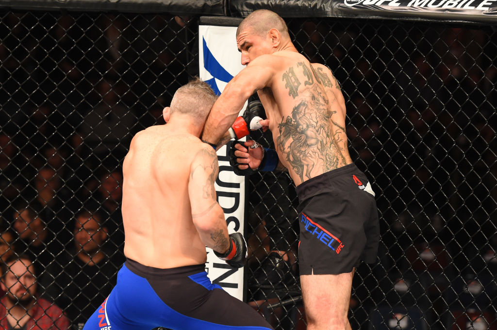 AUCKLAND, NEW ZEALAND - JUNE 11: (R-L) Vinc Pichel punches Damien Brown of Australia in their lightweight fight during the UFC Fight Night event at the Spark Arena on June 11, 2017 in Auckland, New Zealand. (Photo by Josh Hedges/Zuffa LLC)