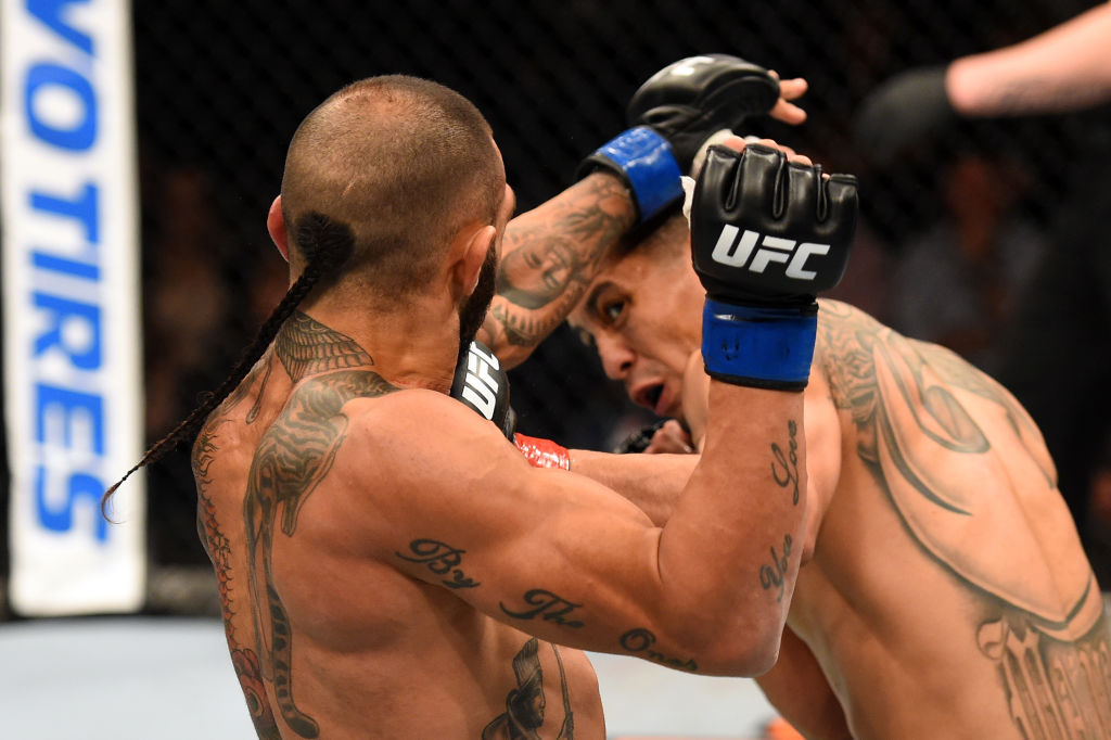 AUCKLAND, NEW ZEALAND - JUNE 11: (R-L) John Moraga punches Ashkan Mokhtarian of Australia in their flyweight fight during the UFC Fight Night event at the Spark Arena on June 11, 2017 in Auckland, New Zealand. (Photo by Josh Hedges/Zuffa LLC)