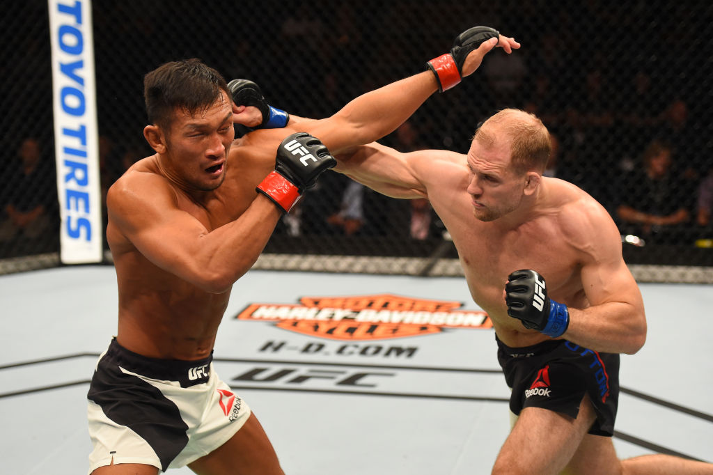 AUCKLAND, NEW ZEALAND - JUNE 11: (R-L) Zak Ottow punches Kiichi Kunimoto of Japan in their welterweight fight during the UFC Fight Night event at the Spark Arena on June 11, 2017 in Auckland, New Zealand. (Photo by Josh Hedges/Zuffa LLC)