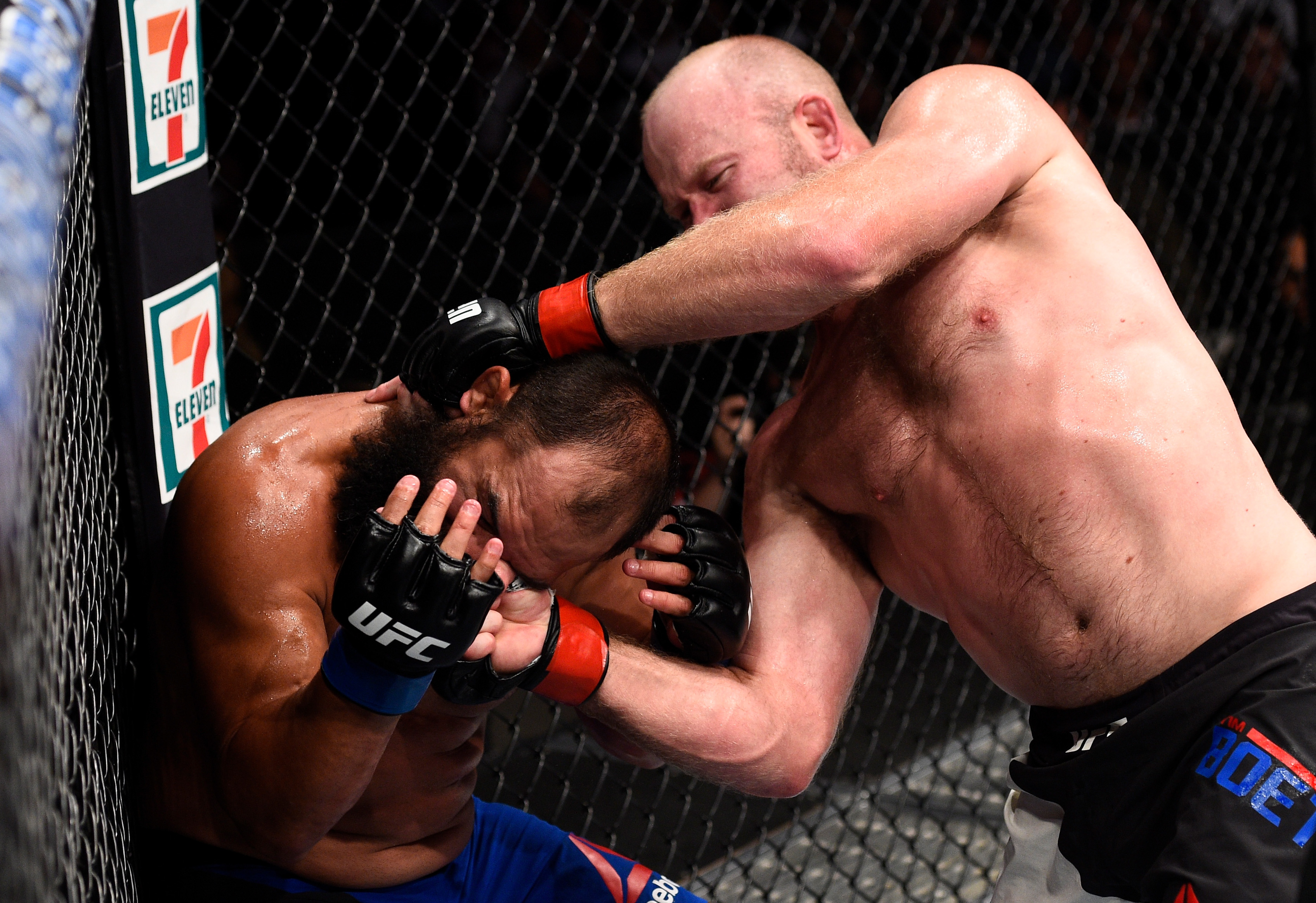 OKLAHOMA CITY, OK - JUNE 25: (R-L) Tim Boetsch punches Johny Hendricks in their middleweight bout during the UFC Fight Night event at the Chesapeake Energy Arena on June 25, 2017 in Oklahoma City, Oklahoma. (Photo by Brandon Magnus/Zuffa LLC)