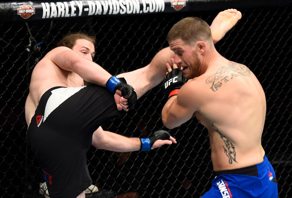  OKLAHOMA CITY, OK - JUNE 25: (L-R) Jeremy Kimball kicks Joshua Stansbury in their light heavyweight bout during the UFC Fight Night event at the Chesapeake Energy Arena on June 25, 2017 in Oklahoma City, Oklahoma. (Photo by Brandon Magnus/Zuffa LLC)