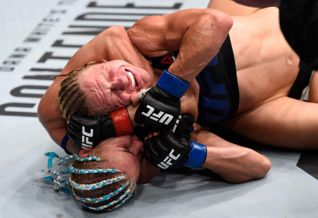 OKLAHOMA CITY, OK - JUNE 25: (L-R) Felice Herrig attempts to secure a rear choke submission against Justine Kish in their women's strawweight bout during the UFC Fight Night event at the Chesapeake Energy Arena on June 25, 2017 in Oklahoma City, Oklahoma. (Photo by Brandon Magnus/Zuffa LLC)