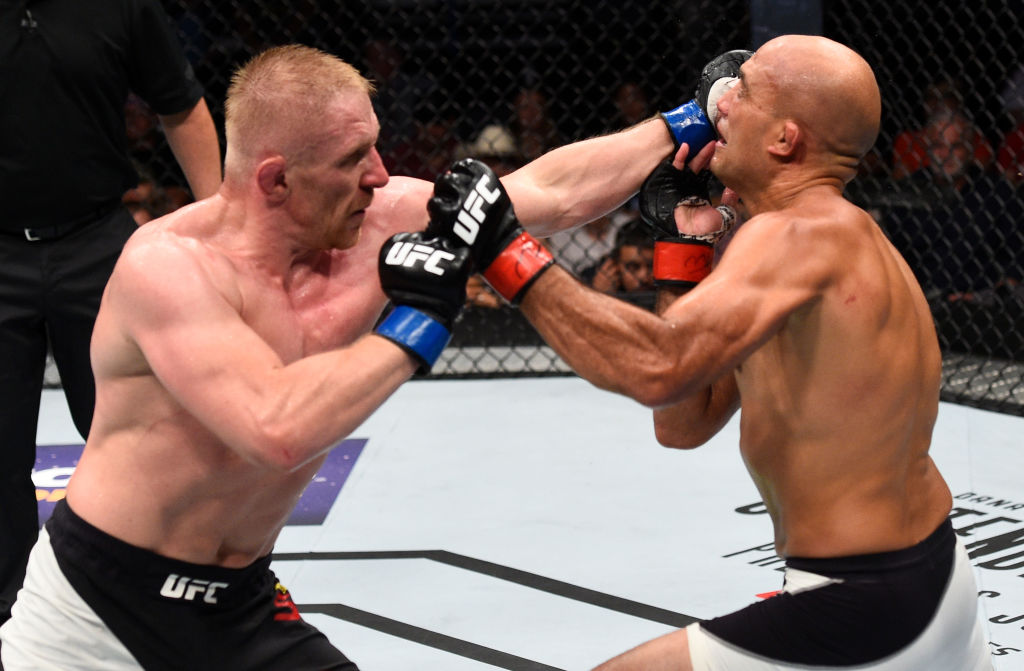 OKLAHOMA CITY, OK - JUNE 25: (L-R) Dennis Siver of Germany punches BJ Penn in their featherweight bout during the UFC Fight Night event at the Chesapeake Energy Arena on June 25, 2017 in Oklahoma City, Oklahoma. (Photo by Brandon Magnus/Zuffa LLC)