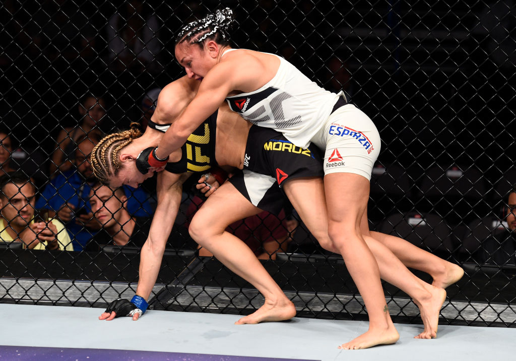 OKLAHOMA CITY, OK - JUNE 25: (R-L) Carla Esparza punches Maryna Moroz of Ukraine in their womens strawweight bout during the UFC Fight Night event at the Chesapeake Energy Arena on June 25, 2017 in Oklahoma City, Oklahoma. (Photo by Brandon Magnus/Zuffa LLC)