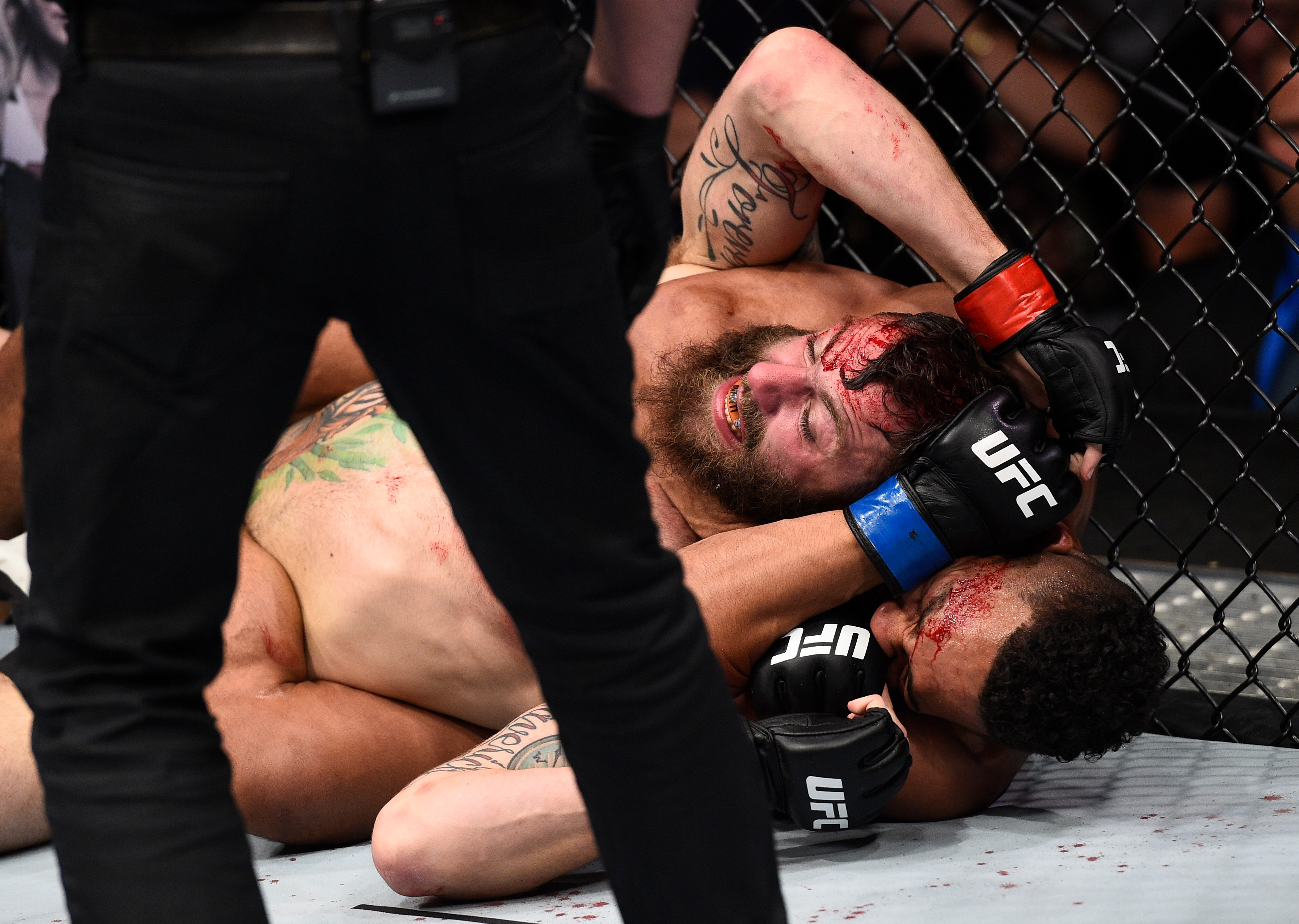 OKLAHOMA CITY, OK - JUNE 25: (R-L) Kevin Lee attempts to submit Michael Chiesa with a rear choke in their lightweight bout during the UFC Fight Night event at the Chesapeake Energy Arena on June 25, 2017 in Oklahoma City, Oklahoma. (Photo by Brandon Magnus/Zuffa LLC)
