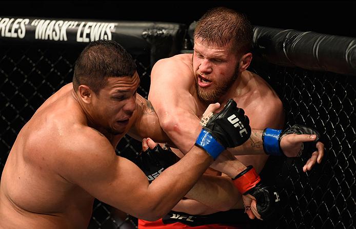 Marcin Tybura punches Luis Henrique during their bout at UFC 209