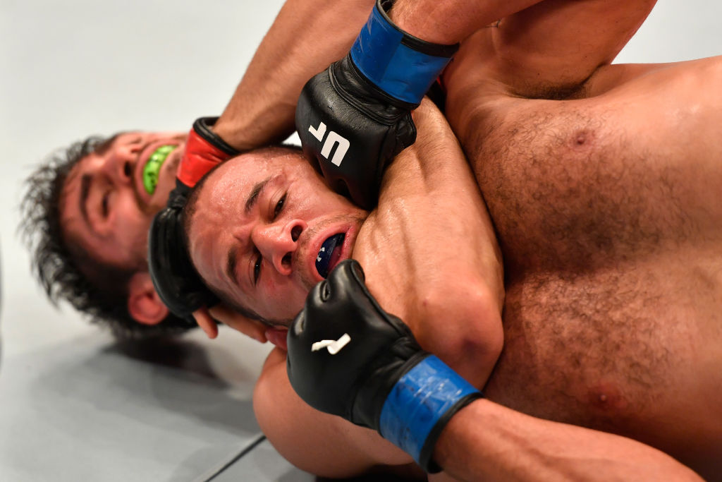 RIO DE JANEIRO, BRAZIL - JUNE 03: (L-R) Antonio Carlos Junior of Brazil secures a rear choke submission against Eric Spicely in their middleweight bout during the UFC 212 event at Jeunesse Arena on June 3, 2017 in Rio de Janeiro, Brazil. (Photo by Jeff Bottari/Zuffa LLC)