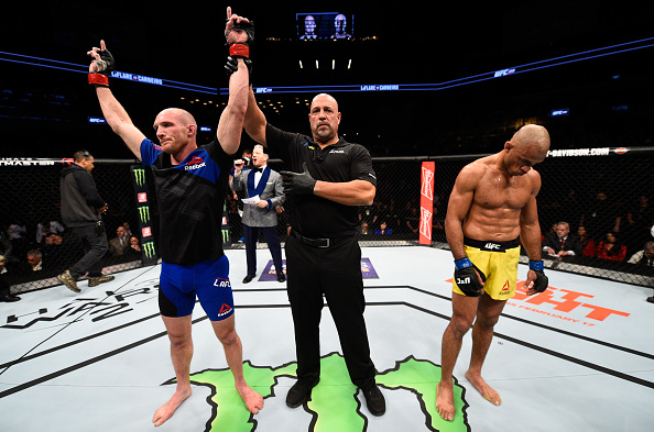 Ryan LaFlare celebrates a victory over <a href='../fighter/Roan-Carneiro'>Roan Carneiro</a> at UFC 208″ align=“center“/><br />In that unattached garage in his buddy Justin Miller’s backyard, Trimble began his coaching journey, one that would lead him to Bellmore Kickboxing / MMA, a top-level gym that not only houses several elite mixed martial artists, but equally renowned kickboxers and boxers as well. In fact, just a few days after this interview, Trimble was already in Nassau Coliseum, where his heavyweight boxer, Adam Kownacki, scored the biggest win of his career, knocking out former world title challenger Artur Szpilka in four rounds.<p>The night before Kownacki’s bout, it was Terrence Hill fighting Chenchen Li in the Glory promotions, and next Saturday, Andre Harrison will compete in a PFL event. It’s a far cry from the days when MMA in New York was <a href=