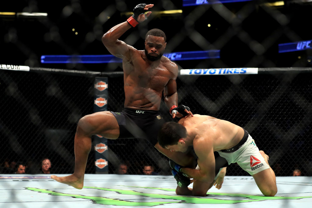 ANAHEIM, CA - JULY 29: <a href='../fighter/Tyron-Woodley'><a href='../fighter/Tyron-Woodley'>Tyron Woodley</a></a> (black shorts) fights <a href='../fighter/Demian-Maia'><a href='../fighter/Demian-Maia'>Demian Maia</a></a> of Brazil in the Welterweight title bout during UFC 214 at Honda Center on July 29, 2017 in Anaheim, California. (Photo by Sean M. Haffey/Getty Images)“ align=“center“/>UFC welterweight champion Tyron Woodley defused the ground attack of No. 1 contender Demian Maia in their UFC 214 co-main event at Honda Center Saturday night, winning a lopsided five-round unanimous decision to retain his crown for the third time and set the stage for what he hoped to be a showdown with former champion <a href=