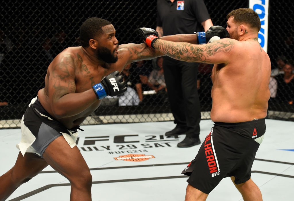  GLASGOW, SCOTLAND - JULY 16: (L-R) Justin Willis punches James Mulheron of England in their heavyweight bout during the UFC Fight Night event at the SSE Hydro Arena Glasgow on July 16, 2017 in Glasgow, Scotland. (Photo by Josh Hedges/Zuffa LLC)