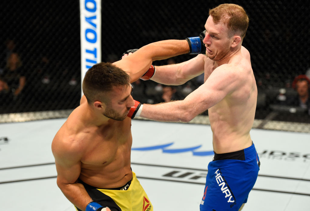 GLASGOW, SCOTLAND - JULY 16: (L-R) Daniel Teymur of Sweden punches Danny Henry of Scotland in their lightweight bout during the UFC Fight Night event at the SSE Hydro Arena Glasgow on July 16, 2017 in Glasgow, Scotland. (Photo by Josh Hedges/Zuffa LLC)