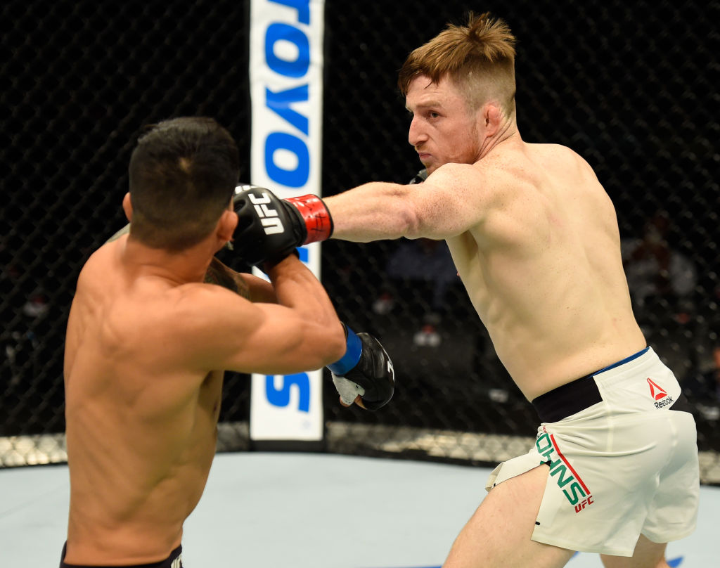 GLASGOW, SCOTLAND - JULY 16: (R-L) Brett Johns of Wales punches Albert Morales in their bantamweight bout during the UFC Fight Night event at the SSE Hydro Arena Glasgow on July 16, 2017 in Glasgow, Scotland. (Photo by Josh Hedges/Zuffa LLC)