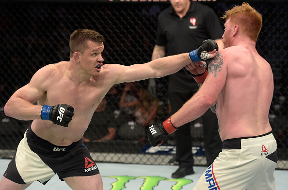 LAS VEGAS, NV - JULY 07: (L-R) CB Dollaway punches Ed Herman in their light heavyweight bout during The Ultimate Fighter Finale at T-Mobile Arena on July 7, 2017 in Las Vegas, Nevada. (Photo by Brandon Magnus/Zuffa LLC/Zuffa LLC via Getty Images)