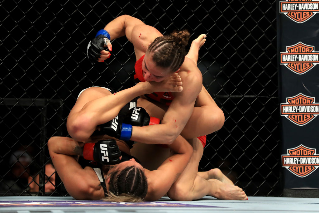 ANAHEIM, CA - JULY 29: Kailin Curran (Bottom) fights <a href='../fighter/Alexandra-Albu'>Alexandra Albu</a> of Russia during their Woman Strawweight fight at UFC 214 at Honda Center on July 29, 2017 in Anaheim, California. (Photo by Sean M. Haffey/Getty Images)“ align=“center“/>In her first fight since April 2015, Russia’s Alexandra Albu won a hard-fought three-round split decision over <a href=