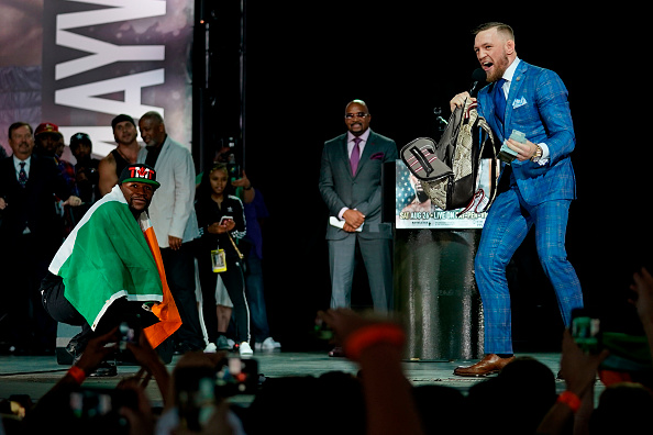 TORONTO, CANADA - JULY 12: (L-R) Floyd Mayweather Jr. and Conor McGregor interact on stage during the Floyd Mayweather Jr. v Conor McGregor World Press Tour event at the Staples Center on July 12, 2017 in Toronto, Ontario, Canada, California. (Photo by Jeff Bottari/Zuffa LLC/Zuffa LLC via Getty Images)