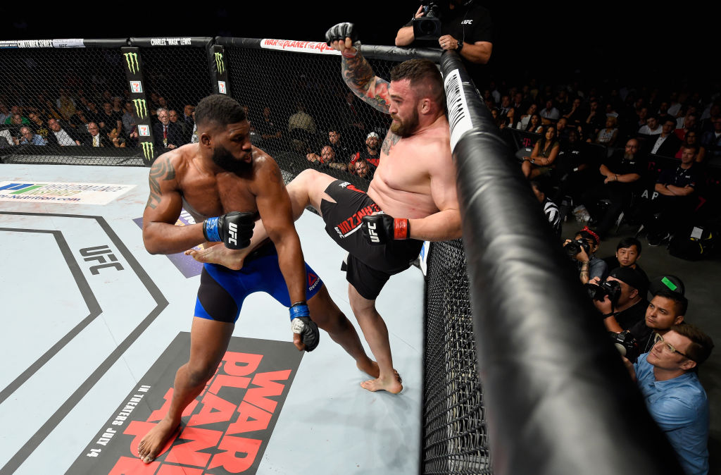 LAS VEGAS, NV - JULY 08: (R-L) <a href='../fighter/Daniel-Omielanczuk'>Daniel Omielanczuk</a> of Poland kicks <a href='../fighter/Curtis-Blaydes'>Curtis Blaydes</a> in their heavyweight bout during the UFC 213 event at T-Mobile Arena on July 8, 2017 in Las Vegas, Nevada. (Photo by Josh Hedges/Zuffa LLC)“ align=“center“/>Heavyweight prospect Curtis Blaydes picked up an important victory as he shut out Daniel Omielanczuk over three rounds.</p><p>Blaydes wasn’t able to get the takedown he was looking for in the opening round, but he pushed the pace and was the busier fighter throughout.</p><p>The strategy didn’t change for the Illinois native in the second, but Omielanczuk was still able to stay upright and keep Blaydes from putting the fight where he wanted it to go, and as the fight wore on, Omielanczuk was getting in his share of shots, including a flush knee to the head, but the edge was likely going to Blaydes because he was pressing the action.</p><p>The heavyweights tired in the final round, with neither fighter pulling ahead significantly, but the early work put in by Blaydes was enough for him to take the win by three scores of 30-27.</p><p>Blaydes improves to 7-1 with 1 NC; Omielanczuk falls to 19-8-1 with 1 NC.</p><p><strong><a href=