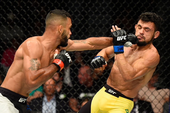 LAS VEGAS, NV - JULY 08: (L-R) Rob Font punches Douglas Silva de Andrade of Brazil in their bantamweight bout during the UFC 213 event at T-Mobile Arena on July 8, 2017 in Las Vegas, Nevada. (Photo by Josh Hedges/Zuffa LLC/Zuffa LLC via Getty Images)
