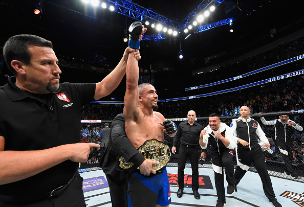 LAS VEGAS, NV - JULY 08: Robert Whittaker of New Zealand celebrates his victory over Yoel Romero of Cuba in their interim UFC middleweight championship bout during the UFC 213 event at T-Mobile Arena on July 8, 2017 in Las Vegas, Nevada. (Photo by Josh Hedges/Zuffa LLC/Zuffa LLC via Getty Images)