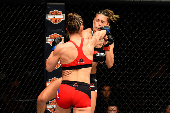  ANAHEIM, CA - JULY 29: Alexandra Albu of Russia punches Kailin Curran in their women's strawweight bout during the UFC 214 event at Honda Center on July 29, 2017 in Anaheim, California. (Photo by Josh Hedges/Zuffa LLC/Zuffa LLC via Getty Images)