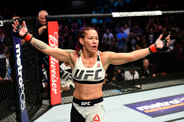 Cyborg celebrates after defeating Tonya Evinger at UFC 214