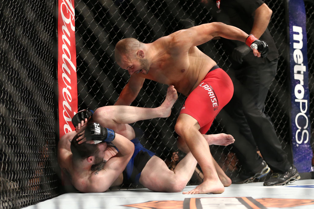 LAS VEGAS, NV - JULY 9: (R-L) Chad Laprise punches Brian Camozzi in their welterweight bout during the UFC 213 event at T-Mobile Arena on July 9, 2017 in Las Vegas, Nevada. (Photo by Rey Del Rio/Getty Images)