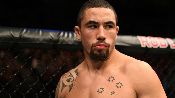 KANSAS CITY, MO - APRIL 15: (L-R) Robert Whittaker of New Zealand punches Jacare Souza of Brazil in their middleweight fight during the UFC Fight Night event at Sprint Center on April 15, 2017 in Kansas City, Missouri. (Photo by Josh Hedges/Zuffa LLC)