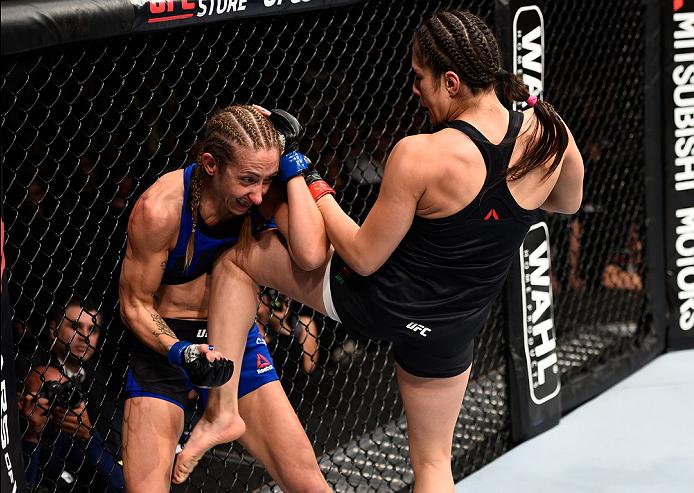 Grasso knees Heather Jo Clark during her UFC debut last November