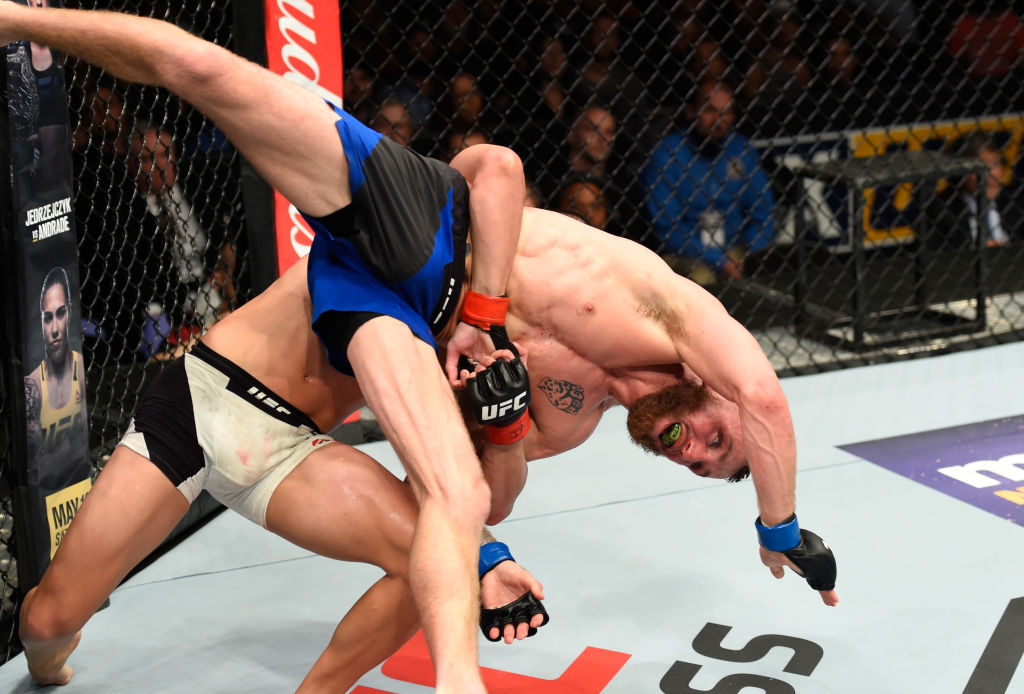 KANSAS CITY, MO - APRIL 15: (L-R) Louis Smolka takes down Tim Elliott in their flyweight fight during the <a href='../event/UFC-Silva-vs-Irvin'>UFC Fight Night </a>event at Sprint Center on April 15, 2017 in Kansas City, Missouri. (Photo by Josh Hedges/Zuffa LLC)“ align=“center“/>The ground is a dangerous place in a mixed martial arts fight. Guys like Tim Elliott and Louis Smolka make it even more treacherous, and for proof, go back to April and Elliott’s three-round decision win over Smolka. For three rounds, they scrambled and scrambled and scrambled some more in a fight that was exhausting to watch, but in a good way. This is another fight to be shown to non-believers, and this group of skeptics is comprised of the ones who say, “Oh man, the ground fighting is boring.” Not in the hands of Elliott and Smolka.</p><p><strong><a href=