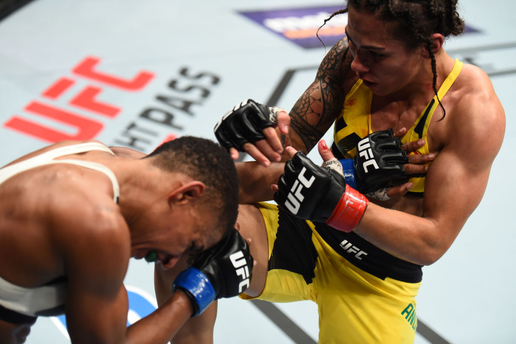 HOUSTON, TX - FEBRUARY 04: (R-L) Jessica Andrade of Brazil knees Angela Hill in their women's strawweight bout during the UFC Fight Night event at the Toyota Center on February 4, 2017 in Houston, Texas. (Photo by Jeff Bottari/Zuffa LLC)