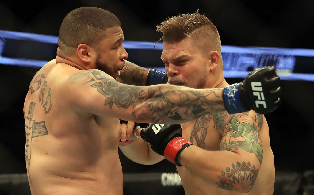 DALLAS, TX - MAY 13: (L-R) Rashad Coulter fights against Chase Sherman in their Heavyweight bout during UFC 211 at American Airlines Center on May 13, 2017 in Dallas, Texas. (Photo by Ronald Martinez/Getty Images)