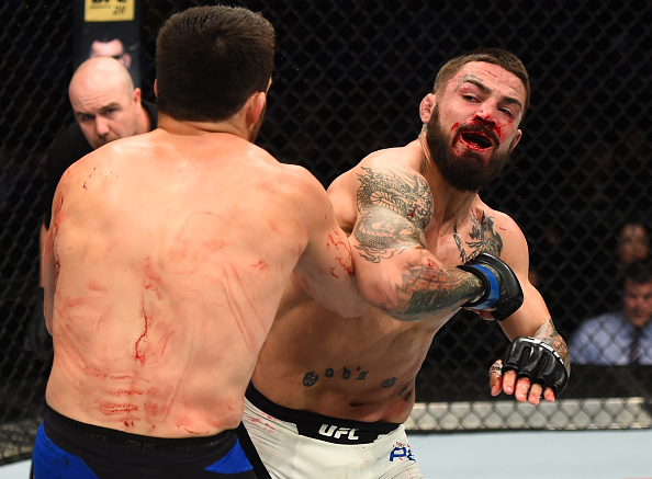 Mike Perry elbows Jake Ellenberger during their bout at Fight Night Nashville in April