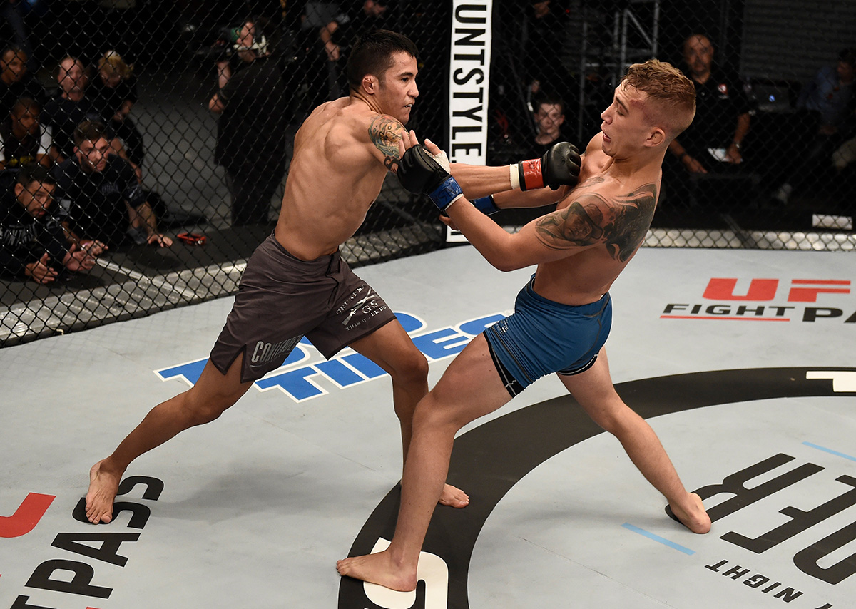 LAS VEGAS, NV - AUGUST 22: (L-R) Joby Sanchez punches JP Buys of South Africa in their flyweight bout during Dana White's Tuesday Night Contender Series at the TUF Gym on August 22, 2017 in Las Vegas, Nevada. (Photo by Brandon Magnus/DWTNCS)