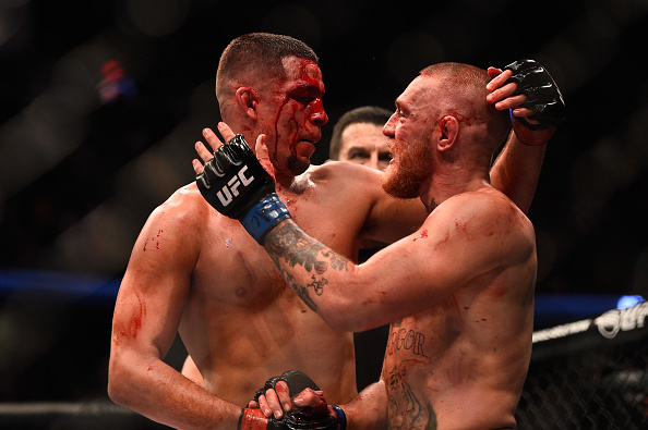 LAS VEGAS, NV - AUGUST 25: Boxer Floyd Mayweather Jr. (L) and UFC lightweight champion Conor McGregor face off during their official weigh-in at T-Mobile Arena on August 25, 2017 in Las Vegas, Nevada. The two will meet in a super welterweight boxing match at T-Mobile Arena on August 26. (Photo by Jeff Bottari/Zuffa LLC)