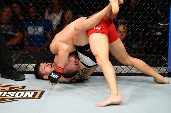 Brandon Moreno attempts to submit Louis Smolka during his UFC debut