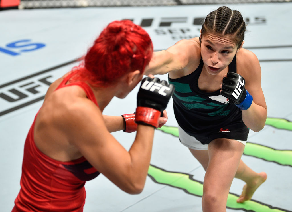 MEXICO CITY, MEXICO - AUGUST 05: (R-L) Alexa Grasso of Mexico punches Randa Markos of Iraq in their women's strawweight bout during the UFC Fight Night event at Arena Ciudad de Mexico on August 5, 2017 in Mexico City, Mexico. (Photo by Jeff Bottari/Zuffa LLC)