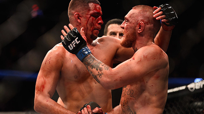 Conor McGregor and Nate Diaz embrace after their rematch at UFC 202