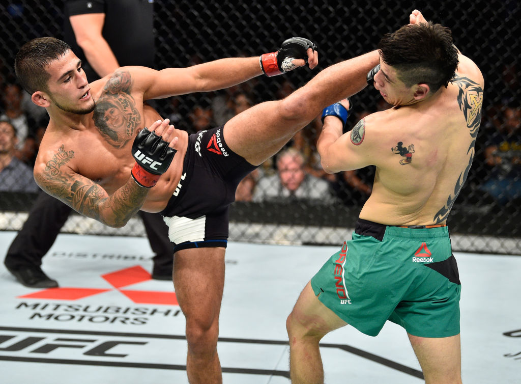 MEXICO CITY, MEXICO - AUGUST 05: (L-R) Sergio Pettis kicks Brandon Moreno of Mexico in their flyweight bout during the UFC Fight Night event at Arena Ciudad de Mexico on August 5, 2017 in Mexico City, Mexico. (Photo by Jeff Bottari/Zuffa LLC)